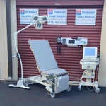 Exam Tables For Sale Mpi Model 8087 Graphite Upholstery Stir Ups Power & Tilt. Fixed Price $3270.00.